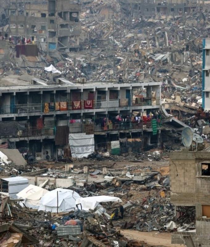 In Gaza’s cash crunch, woman turns banknote repair into a lifeline