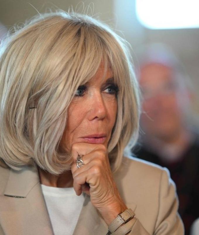 French first lady apologises after activist slur fuels social media backlash