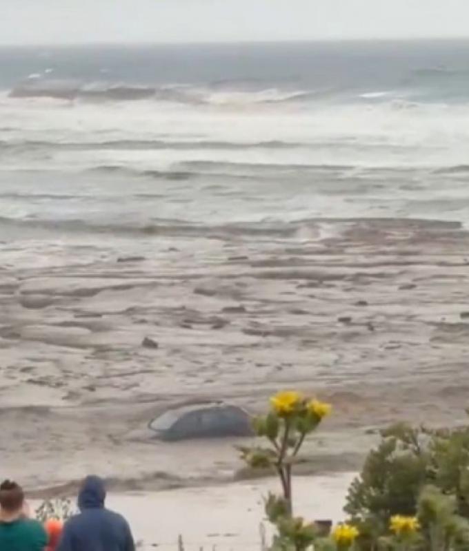 Cars swept into sea as floods cut off Great Ocean Road; bushfires ravage Victoria