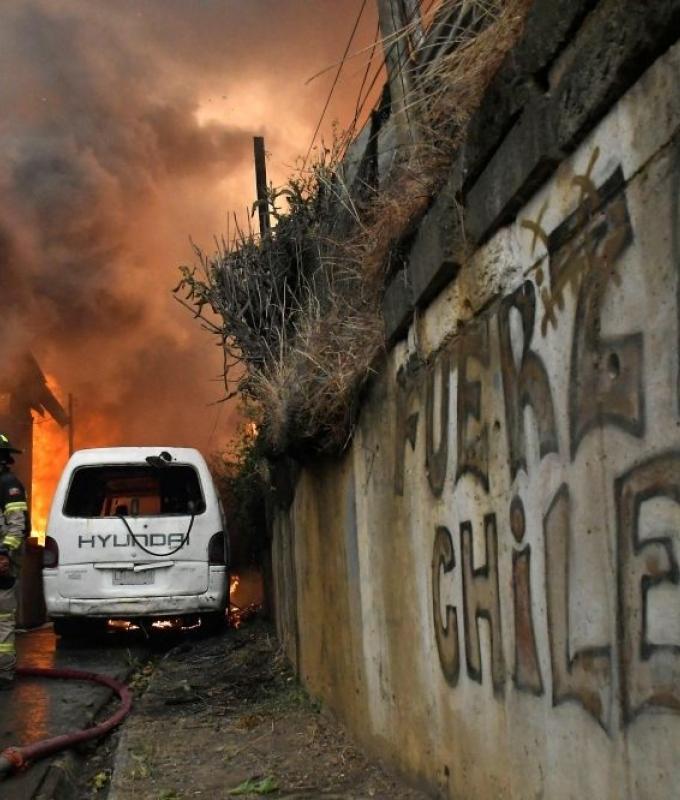 Southern Chile burns as wildfires kill 18, force tens of thousands to flee