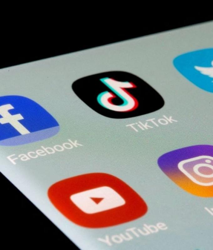 Macron pushes law to bar under-15s in France from social networks ‘as early as next fall’