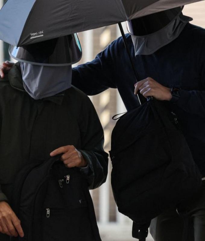 Hong Kong convicts father of wanted activist over handling of funds