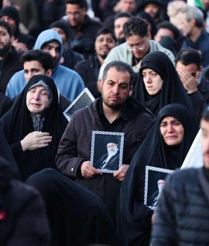 Iran divided: As some mourners weep in Tehran, others topple statues and dance in streets