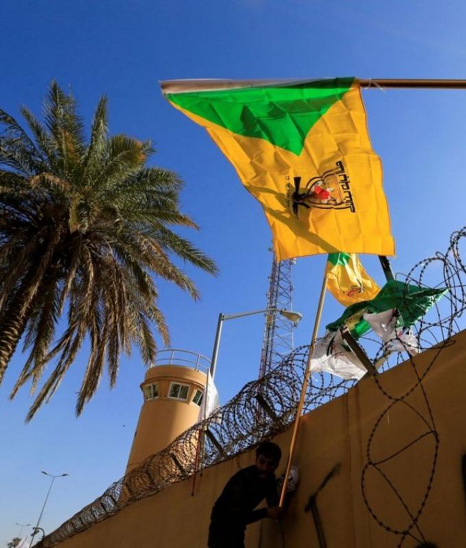 Iraq’s pro-Iran group agrees five-day truce on US embassy attacks amid regional war