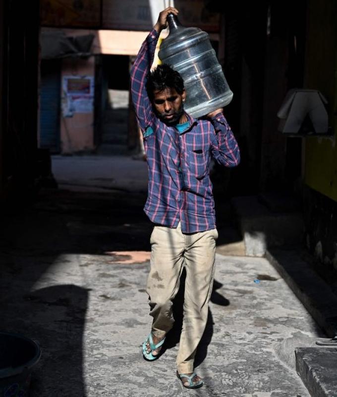 ‘We will leave when money runs out’: Migrant workers in Delhi hit by soaring LPG costs