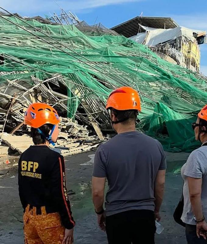 Two trapped people alive after Philippines building collapse, rescue continues