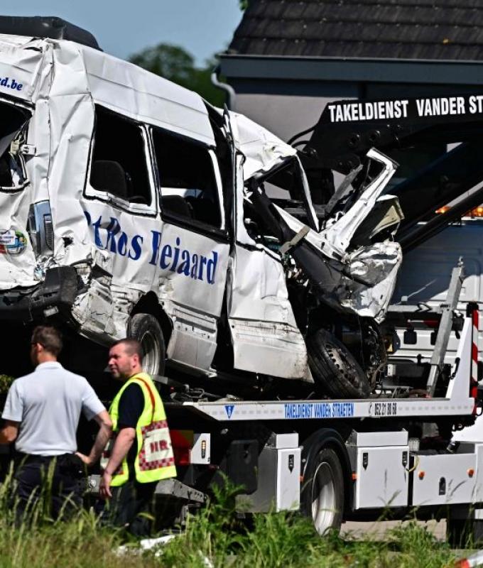 Four killed after train crashes into school minibus at Belgian rail crossing