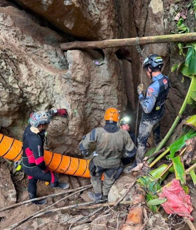 Laos cave rescue: Four men carried out on stretchers, two remain missing after flash floods