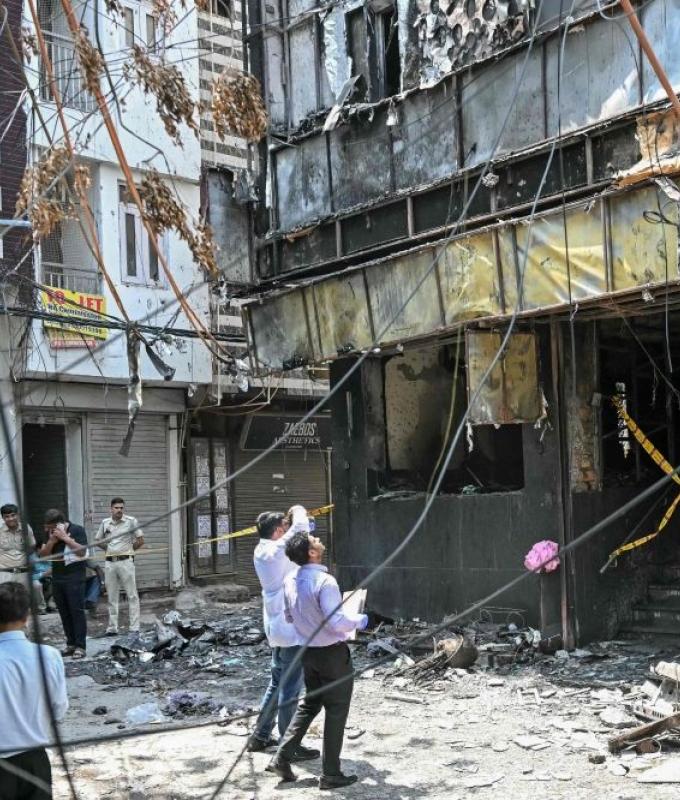Eighteen foreign nationals among 21 killed in Delhi hotel fire, witnesses describe people jumping to escape flames