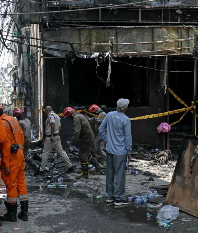 India detains hotel owner as probe begins into fire that left 21 dead amid scrutiny of safety standards