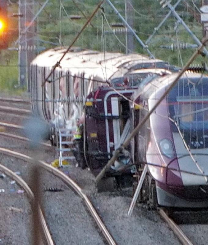 ‘Huge bang’ as two trains crash north of London, killing one passenger