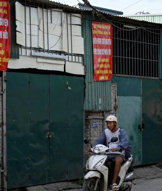 Silent prayers, cautious banners as Hanoi residents resist Red River mega-project