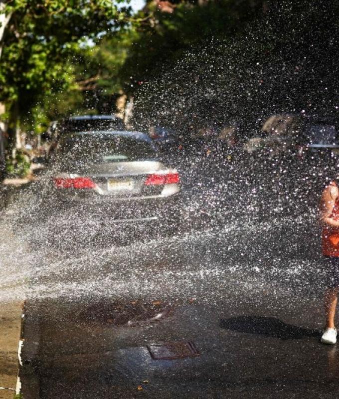 New Yorkers crack hydrants to cool off as 43°C heat index melts city streets