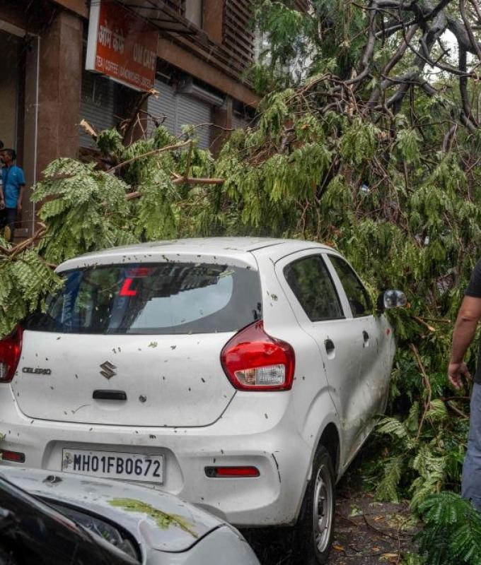 Building collapse kills six in Mumbai as torrential rain batters city