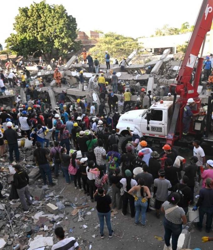 Colombian rescuers pull woman alive from quake rubble as death toll hits 216