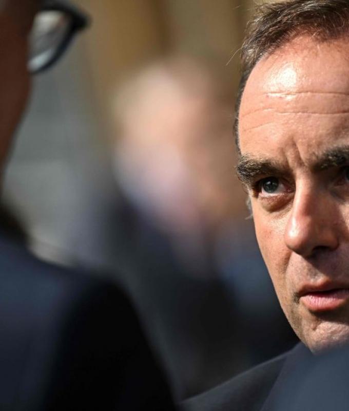 Residents jeer French PM on visit to fire-hit region