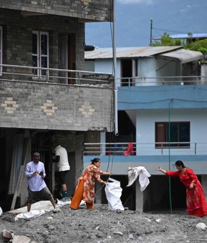 Grisly search for missing as Nepal morgues overflow, burials begin