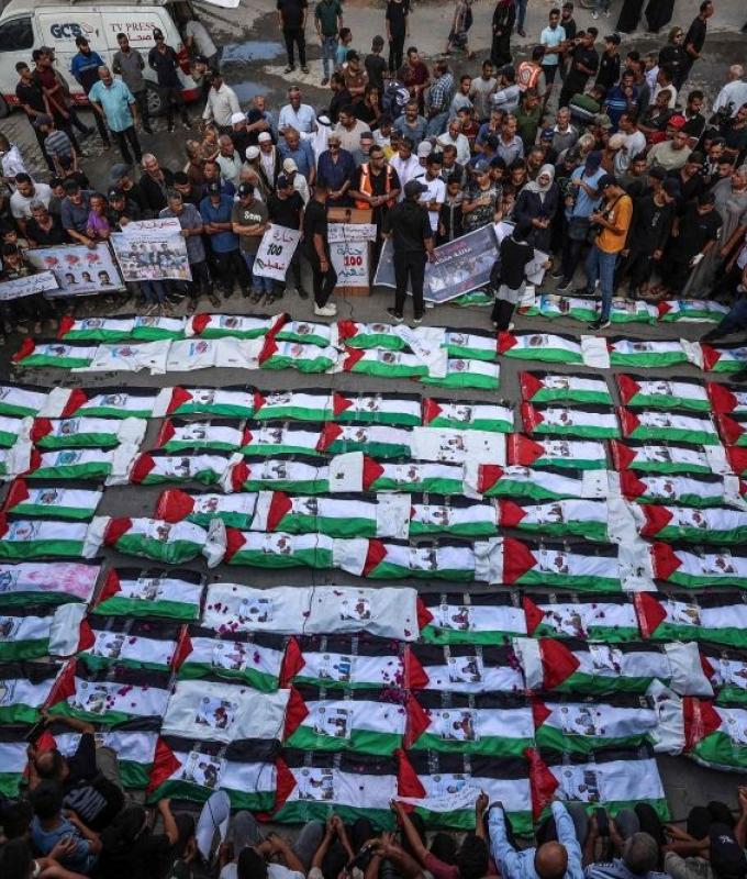 Gaza mourns 100 victims recovered from rubble in one of its largest funerals