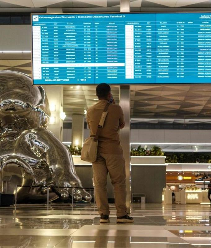 Indonesia reopens major airports after ash shutdown as stranded travellers welcome gradual return of flights