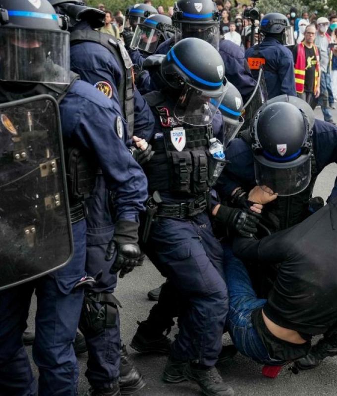 France suspends stun grenades at student protests after teen loses hand