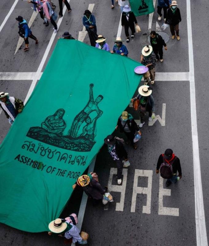 ‘Please don’t make us poorer’: Bangkok protesters challenge IMF, World Bank over spending cuts