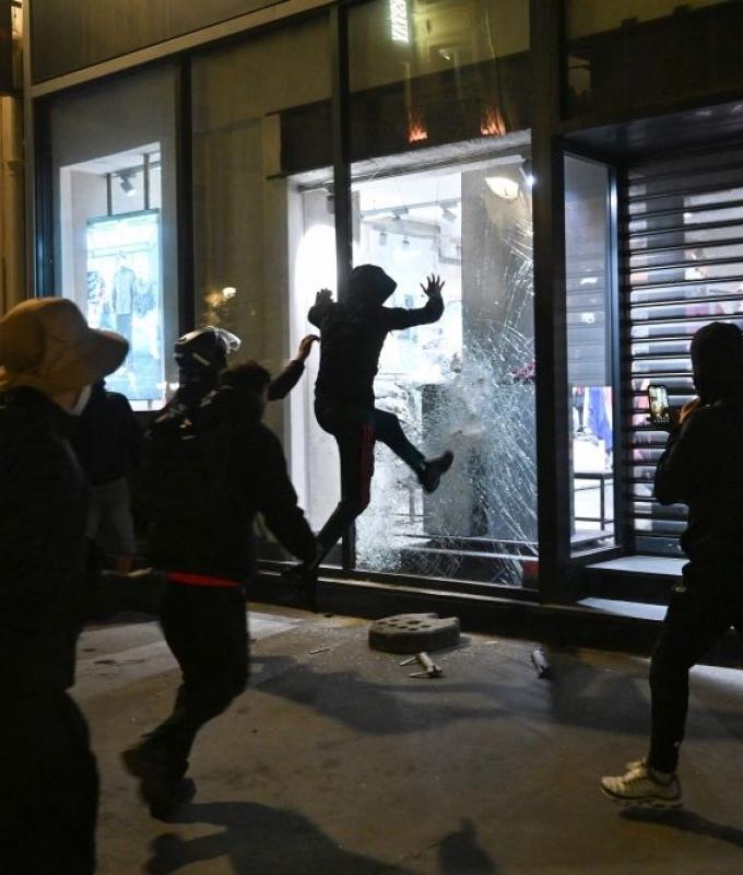 Curfews imposed in Paris, Lille, Lyon as France reels from weekend protest violence