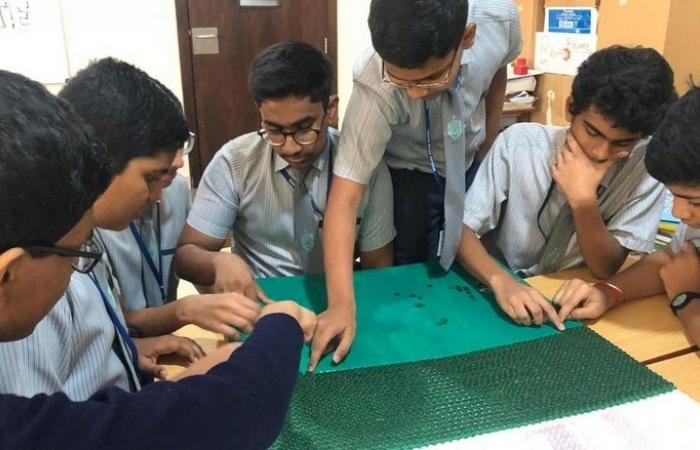 Sharjah - Art class creates UAE flag with 65,000 buttons