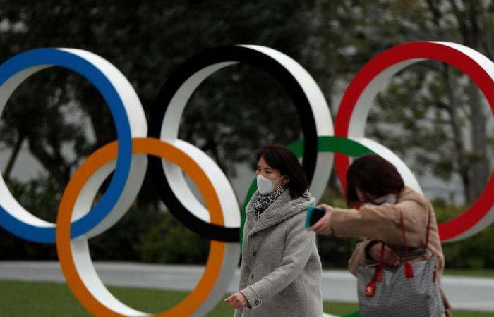 Japan questions why virus cases spiking after Olympics announcement