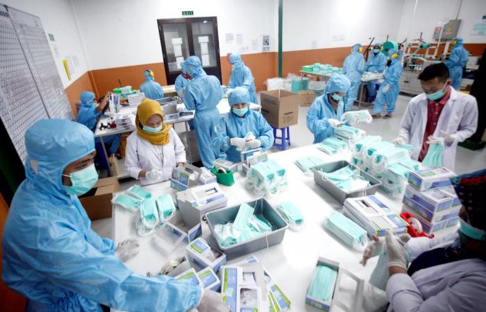 Raincoats and donations: Indonesia’s doctors battle virus surge