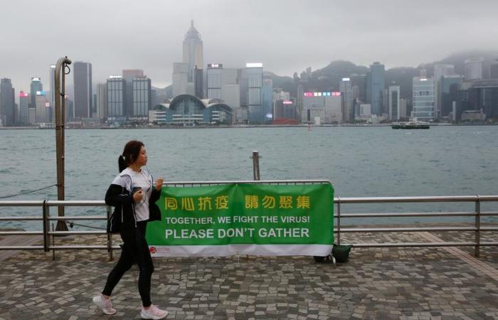 New virus cluster spurs Hong Kong to extend border curbs and limit on gatherings