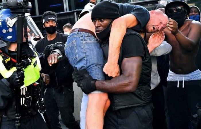 Black British protester reflects on viral photo of him helping white man