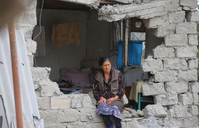 Nagorno-Karabakh residents inspect destroyed homes as ceasefire breaks
