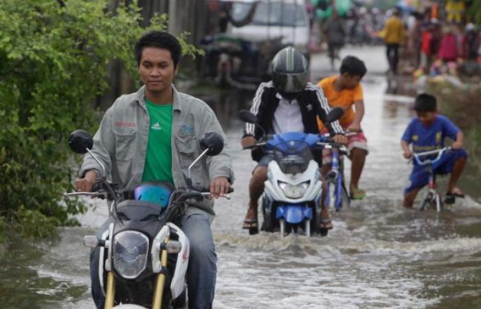 Floods in Southeast Asia leave at least 20 dead and thousands...