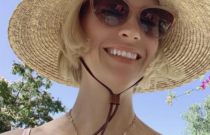 January Jones poses in a pink bra for Breast Cancer Awareness...