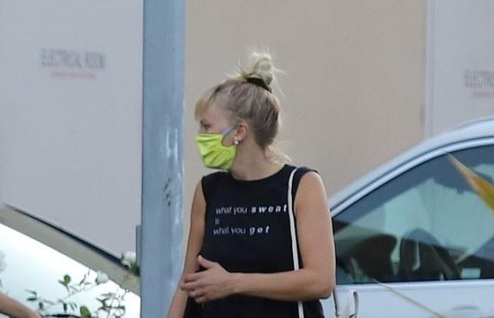 Malin Akerman dons a tank top and animal-themed leggings as she...