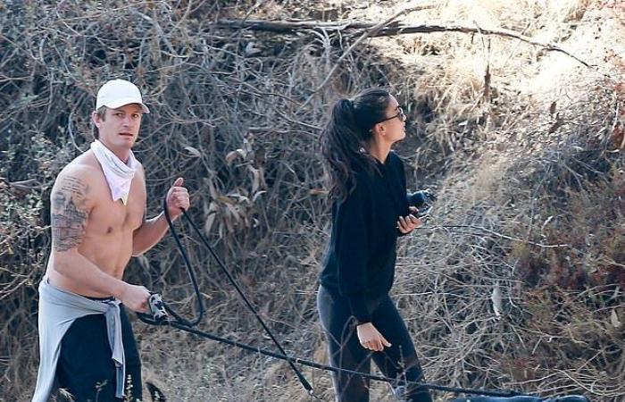 Joel Kinnaman shows off chiseled chest while walking two dogs with...