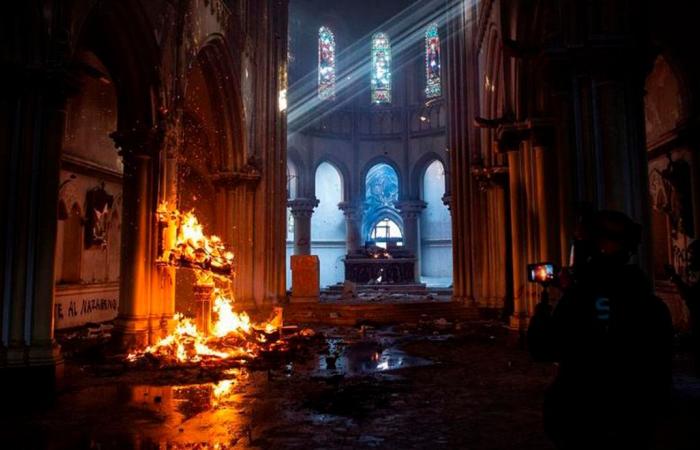 Hooded men set fire to and destroy churches during protests in...