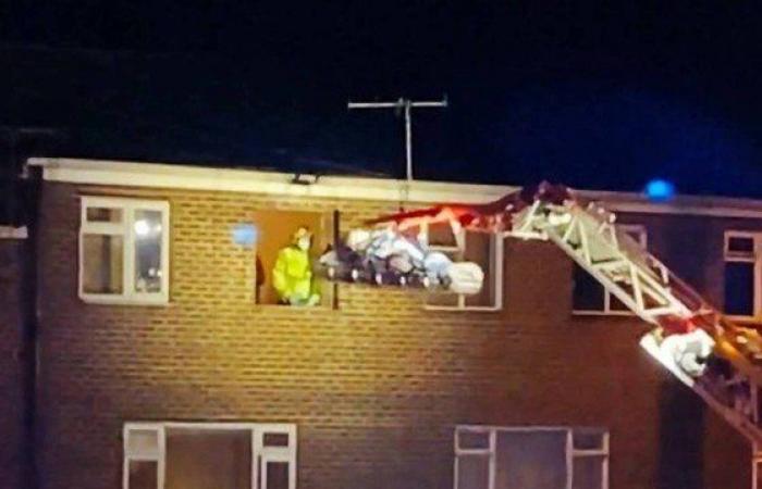 Obese man is removed from home by crane to be treated...