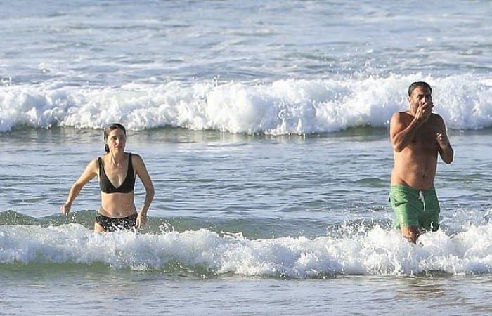 Rose Byrne, 41, shows off her figure in a black bikini...
