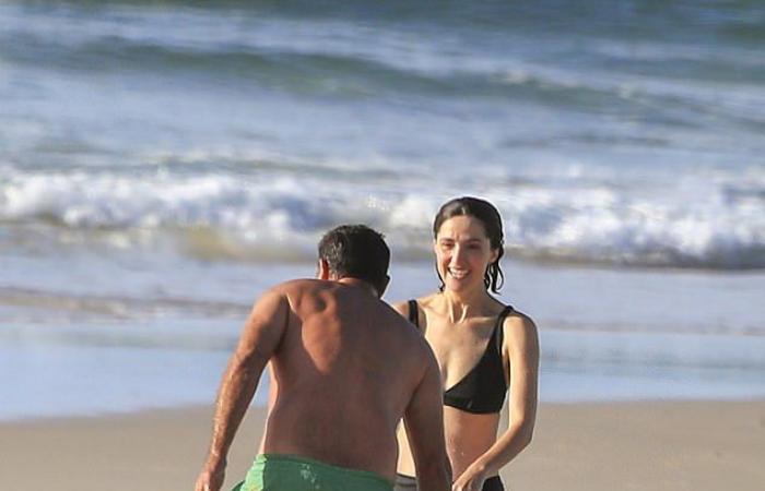 Rose Byrne, 41, shows off her figure in a black bikini...