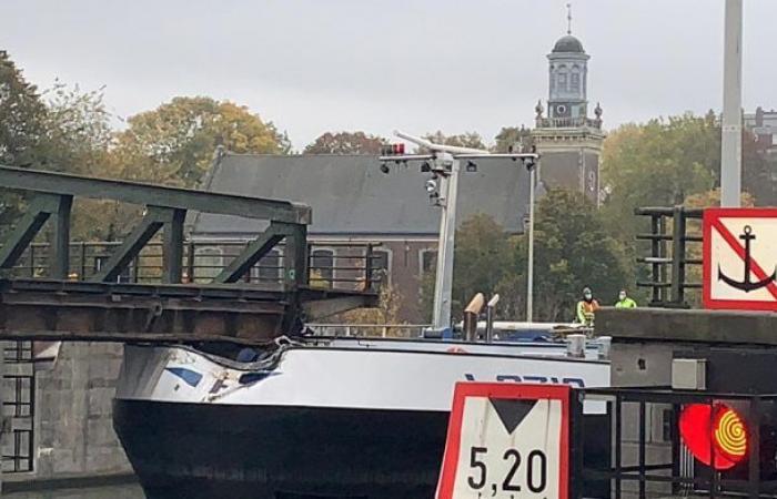 Oil tanker sails against important bridge in Ghent harbor area …...