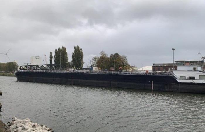 Oil tanker sails against important bridge in Ghent harbor area …...