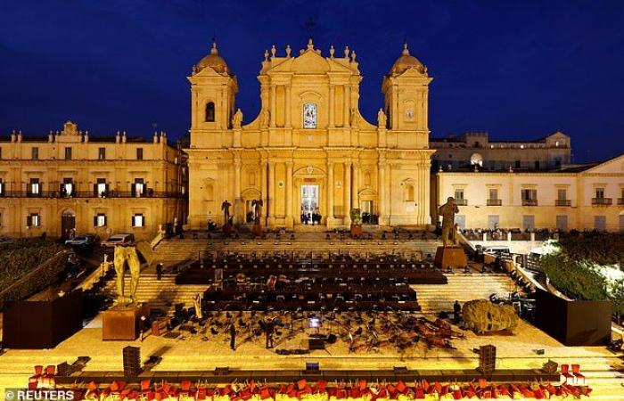 Andrea Bocelli, 62, appears on the steps of Noto Cathedral in...
