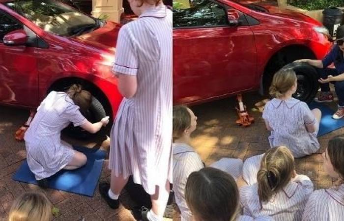 Girls learn to change tires and see oil level