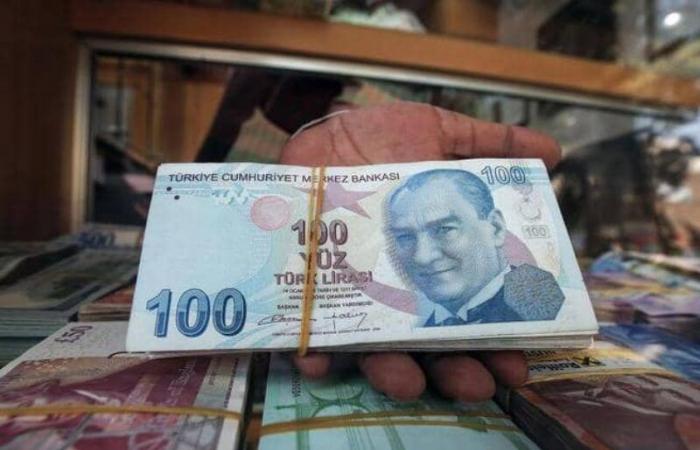 The Turkish lira is falling to a record level against the...