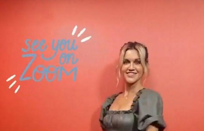 Ashley Roberts wears a leather look dress with oversized sleeves