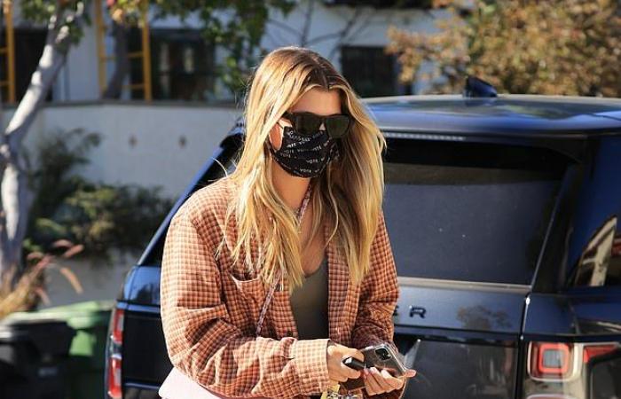 Sofia Richie rocks a plaid shirt while meeting a friend at...