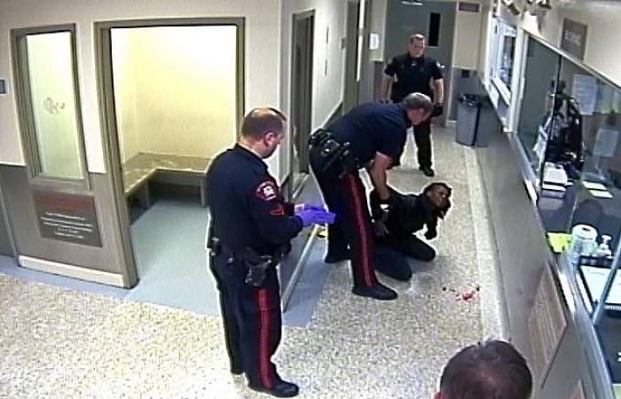 The surveillance footage shows a Calgary police officer slamming a handcuffed...