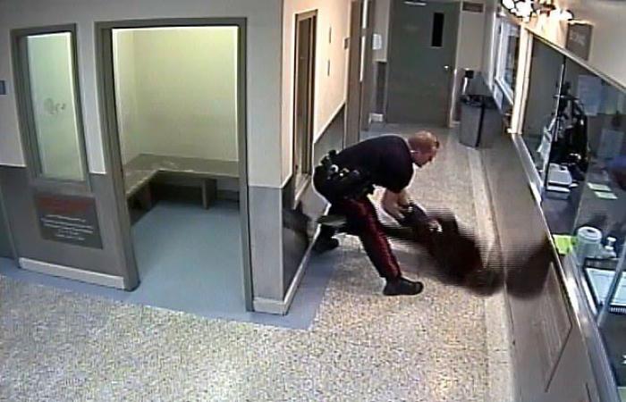 The surveillance footage shows a Calgary police officer slamming a handcuffed...
