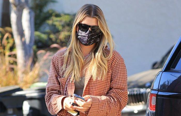 Sofia Richie rocks a plaid shirt while meeting a friend at...